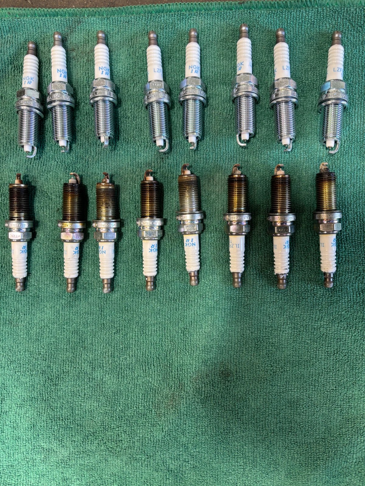 New and worn spark plugs compared